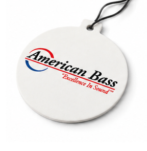 Introducing the American Bass Hanging Air Freshener - Clean n Fresh by American Bass Audio—a round, white air freshener with a string for easy hanging. It showcases the iconic American Bass logo and the slogan “Excellence In Sound” in bold red text below. Experience a refreshing Clean n Fresh scent every time you enter your car.