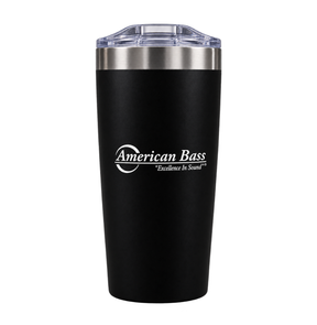 The American Bass Audio Yowie Vacuum Tumbler - 18 oz is a sleek black, vacuum-insulated tumbler with a clear lid. It features the American Bass logo and the slogan “Excellence in Sound” printed in white on the front, making it perfect for keeping your drinks hot or cold while showing your passion for quality sound.