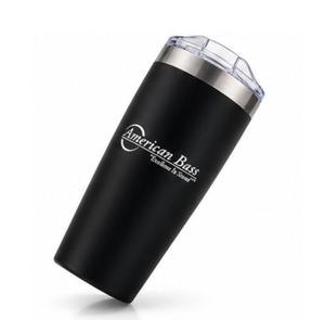 The American Bass Audio Yowie Vacuum Tumbler - 18 oz is a black, vacuum-insulated tumbler with a clear lid and stainless steel rim, featuring the American Bass logo and the words “Excellence in Sound” printed in white on the side.
