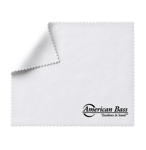 An American Bass Audio Multipurpose Cleaning Cloth, measuring 8″ x 8″, is shown in white microfiber with one corner folded over. The lower right corner features the American Bass Audio logo and the slogan “Excellence In Sound” printed in black.