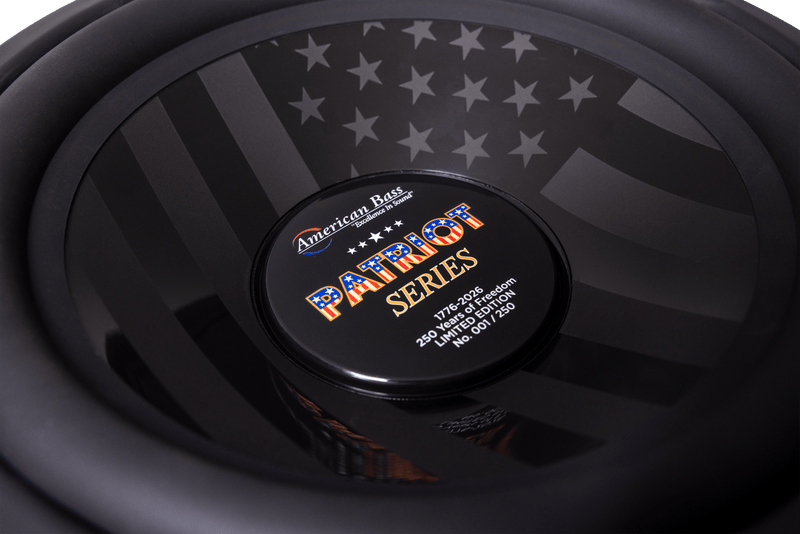 Close-up of the American Bass Patriot Series Limited 250 Edition Subwoofer, showcasing its black and gray American flag design, labeled 250 watts, 4 ohm, and individually numbered as #61 of only 120 produced.